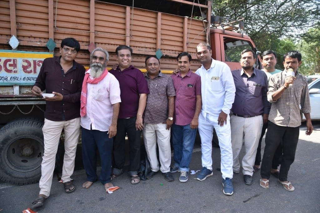 Group of Navchetna Charitable Trust volunteers posing after food distribution in Ambaji